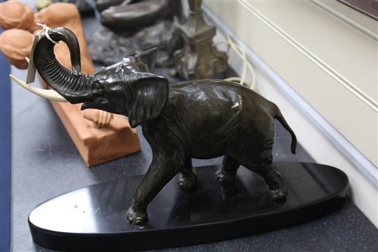 A French Art Deco patinated bronze model of a elephant, 23in.